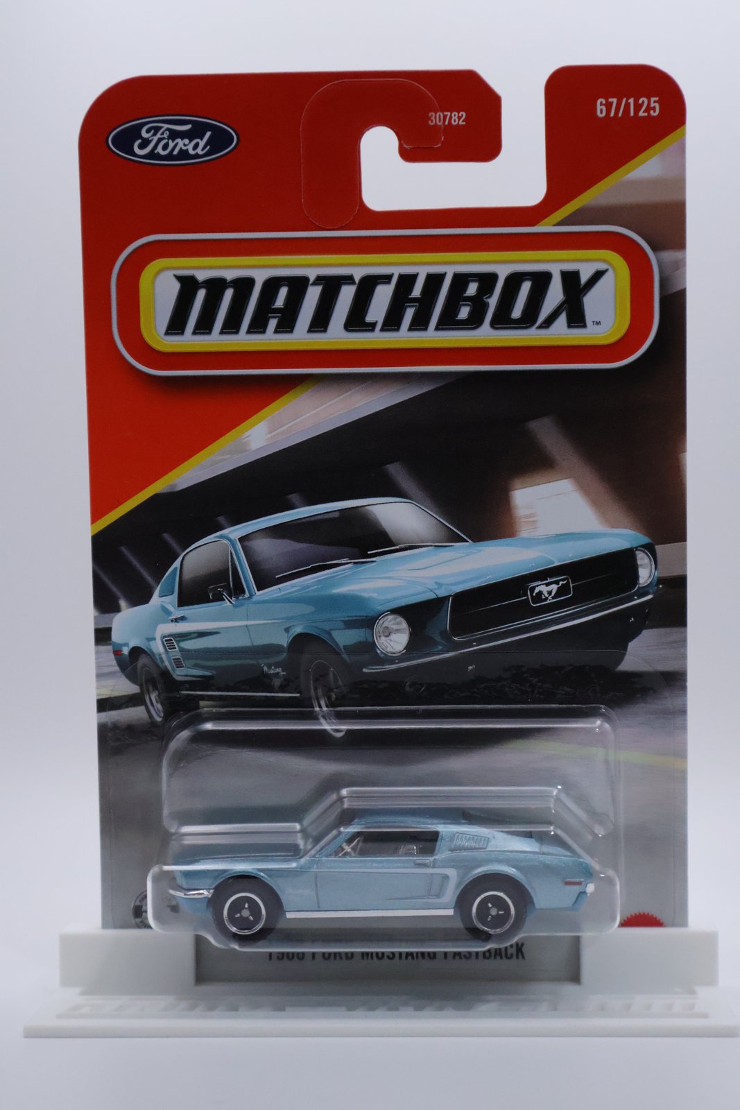 Matchbox 1968 Ford Mustang Fastback light blue 1:64 diecast, front of card