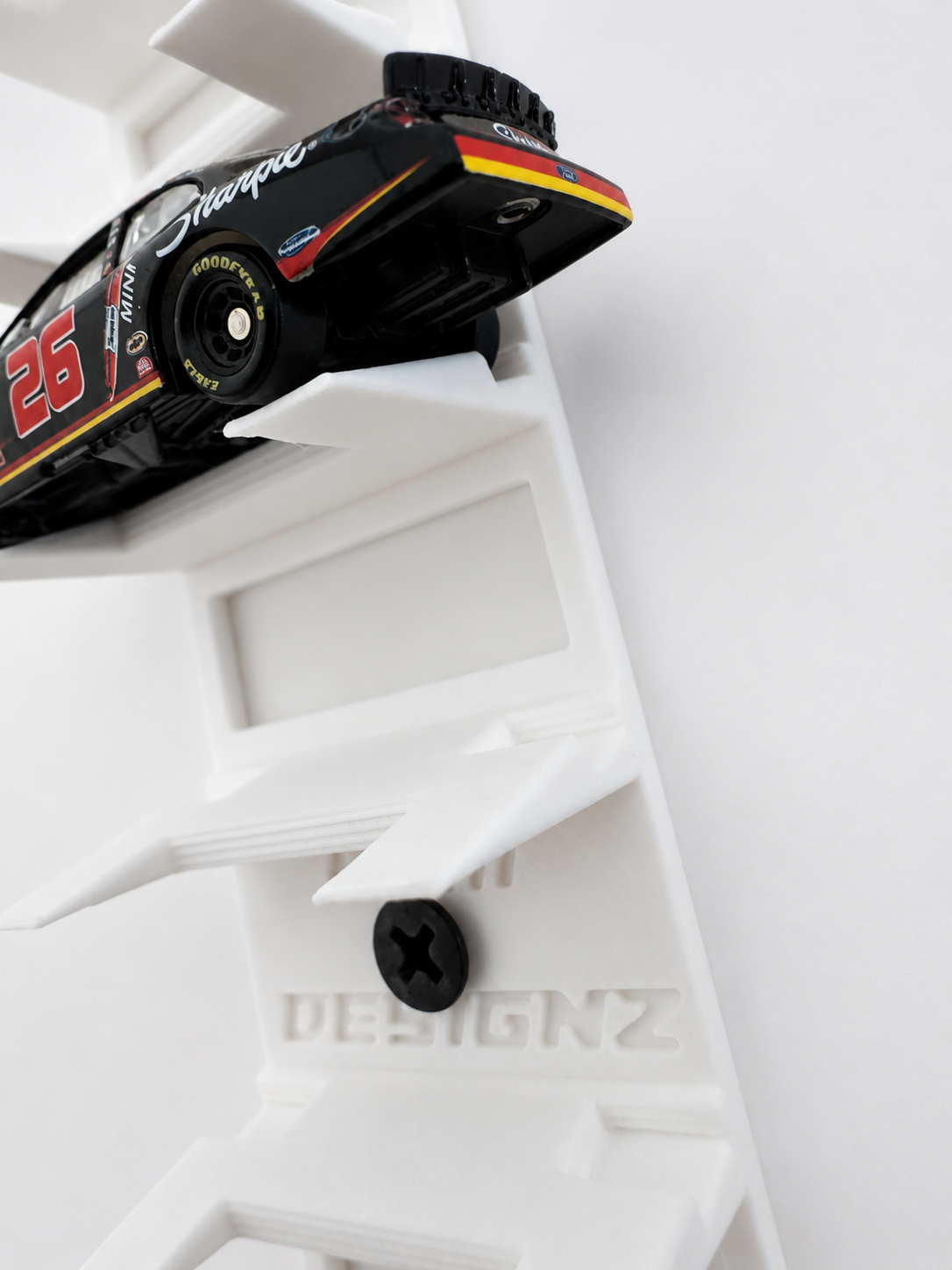 Close-up of RAM Designz 1/64 scale diecast wall display shelf and mounting screw