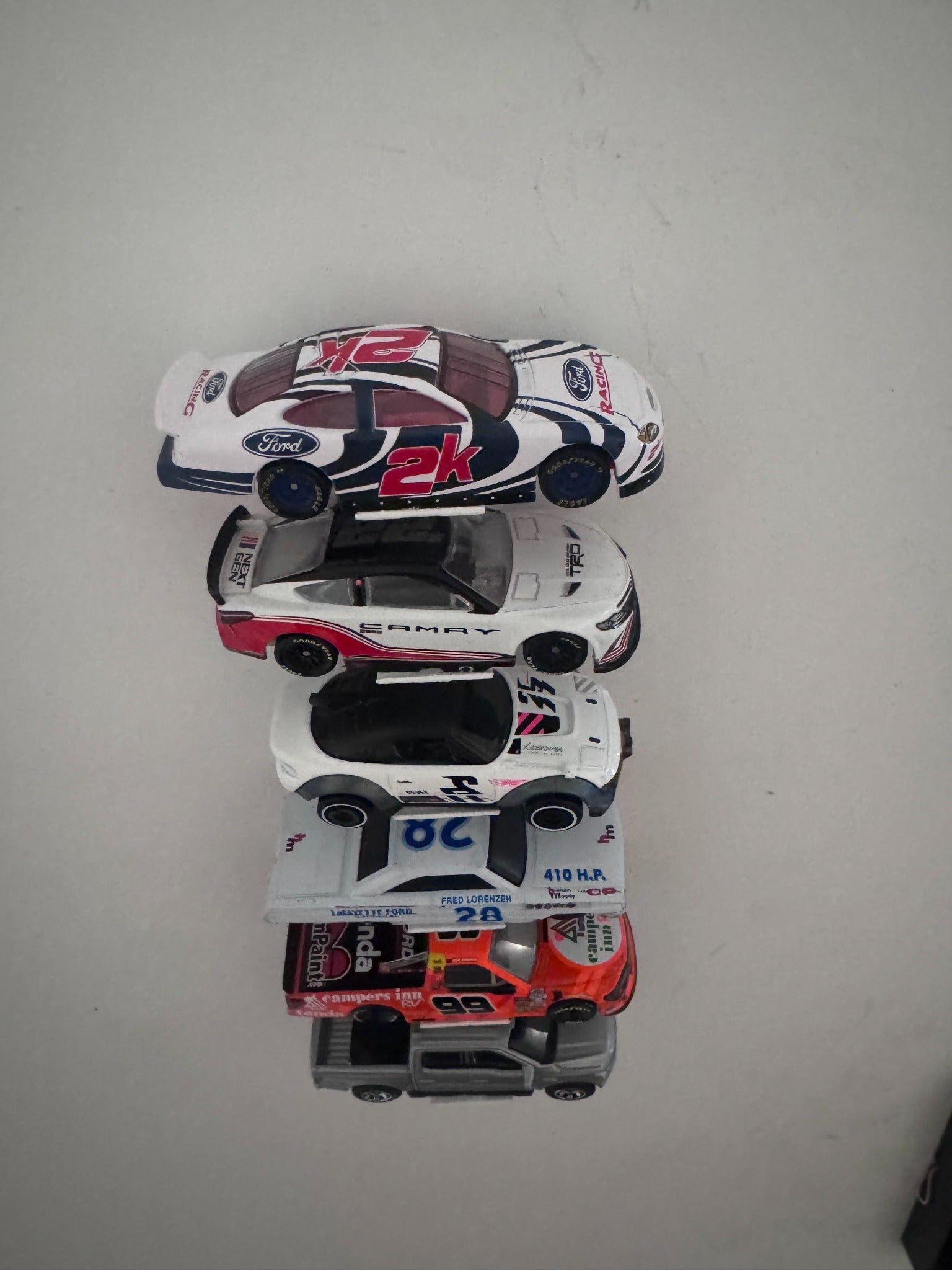Front underside view showing the universal display supporting different diecast vehicle widths and body styles